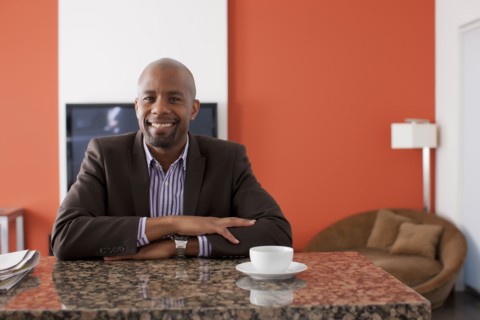 Man enjoying coffee at home. 
Photo : Dan Bannister