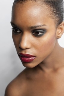 Portrait of young woman in seductive make-up. 
Photo: Jan Scherders