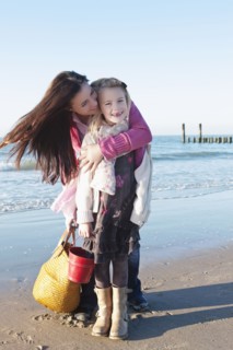 Netherlands, Zeeland, Haamstede, Mother with daughter on beach. 
Photo: Jan Scherders