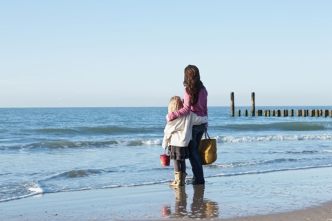 Netherlands, Zeeland, Haamstede, Mother with daughter on beach. 
Photo: Jan Scherders