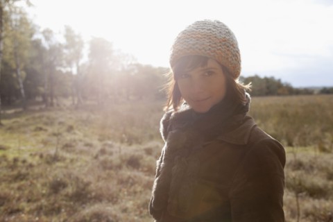 Netherlands, Utrechtse Heuvelrug, Portrait of young woman in winter countryside. 
Photo: Jan