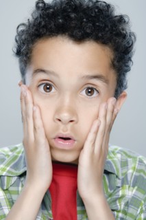 Portrait of boy (8-9), studio shot. 
Photo: Rob Lewine