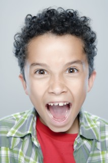 Portrait of boy (8-9), studio shot. 
Photo : Rob Lewine