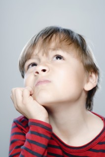 Portrait of boy (6-7), studio shot. 
Photo : Rob Lewine