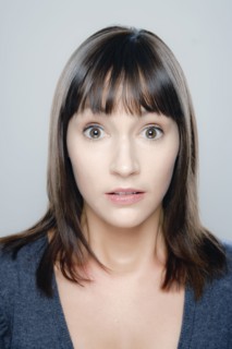 Portrait of young woman, studio shot. 
Photo : Rob Lewine