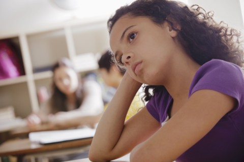 Portrait of schoolgirl (10-11) contemplating. 
Photo : Rob Lewine
