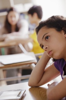 Portrait of schoolgirl (10-11) contemplating. 
Photo : Rob Lewine