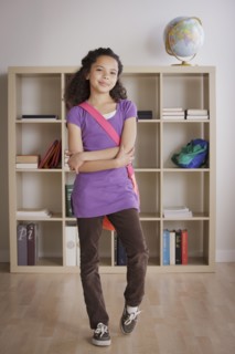 full length schoolgirl (10-11) standing in classroom. 
Photo : Rob Lewine