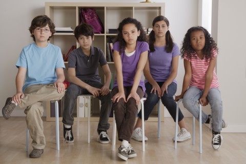 Portrait of serious pupils sitting in classroom. 
Photo : Rob Lewine