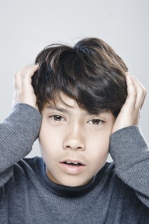 Portrait of boy (12-13) expressing stress. 
Photo : Rob Lewine