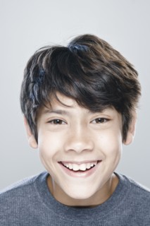Portrait of boy (12-13) expressing positively. 
Photo : Rob Lewine