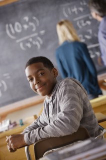 Portrait of teenage boy (14-15) at school. 
Photo : Rob Lewine