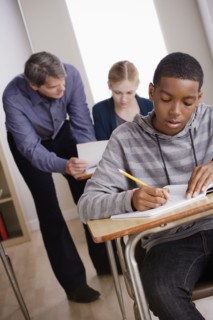 Teacher with teenage students (14-15) at school. 
Photo : Rob Lewine