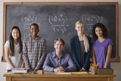 Teacher with teenage students (14-15,16-17) at school. 
Photo : Rob Lewine