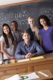 Teacher with teenage students (14-15,16-17) at school. 
Photo : Rob Lewine