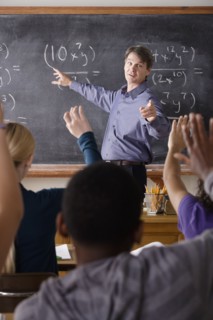 Teacher with teenage students (14-15,16-17) at school. 
Photo : Rob Lewine