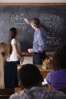 Teacher with teenage students (14-15,16-17) at school. 
Photo : Rob Lewine