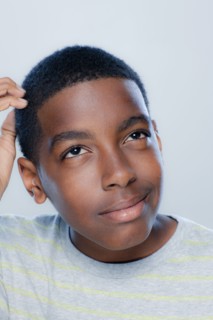 Portrait of teenage boy (14-15), studio shot. 
Photo : Rob Lewine