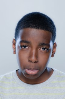 Portrait of teenage boy (14-15), studio shot. 
Photo : Rob Lewine