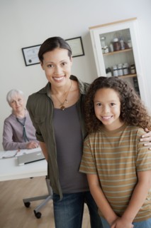 Girl (8-9) with mother at doctor's office. 
Photo : Rob Lewine