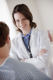Smiling doctor talking with patient. 
Photo : Rob Lewine