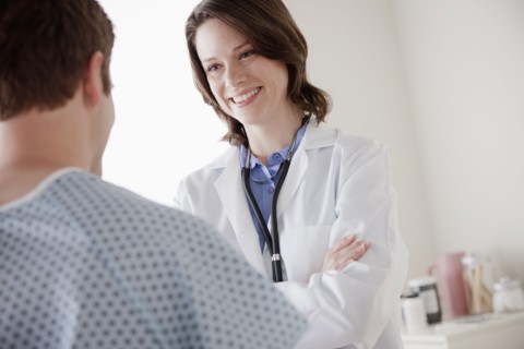 Smiling doctor talking with patient. 
Photo : Rob Lewine