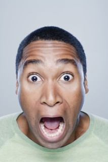 Portrait of screaming young man, studio shot. 
Photo : Rob Lewine