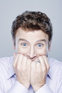 Portrait of worried mid adult man, studio shot. 
Photo: Rob Lewine