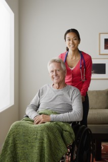 Portrait of young female nurse and senior man. 
Photo : Rob Lewine