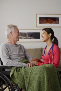Young female nurse taking care of senior man. 
Photo: Rob Lewine