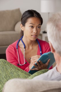 Female nurse with senior patient at home. 
Photo: Rob Lewine