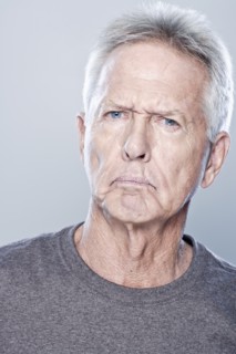 Portrait of angry senior man, studio shot. 
Photo : Rob Lewine