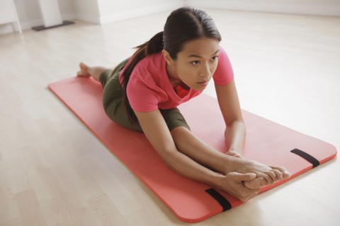 Young woman exercising. 
Photo: Rob Lewine