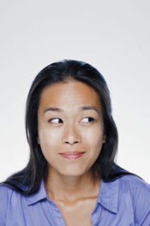 Portrait of smiling young woman, studio shot. 
Photo : Rob Lewine