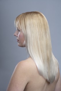 View of woman with blonde hair, studio shot. 
Photo : Mark de Leeuw