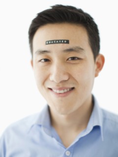 Portrait of young man with word educated on forehead, studio shot. 
Photo: Jessica Peterson