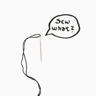 Needle and thread with text in speech bubble, studio shot. 
Photo : Jessica Peterson