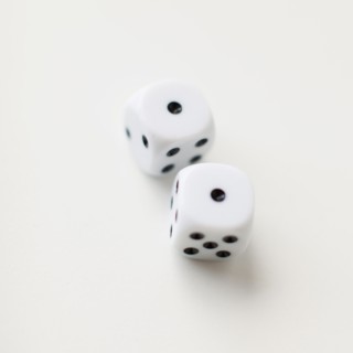 Dices on white background, studio shot. 
Photo: Jessica Peterson