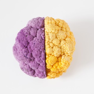 Yellow and purple cauliflower, studio shot. 
Photo: Jessica Peterson