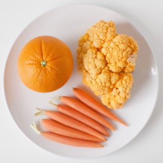 Orange fruits and vegetables on plate. 
Photo: Jessica Peterson