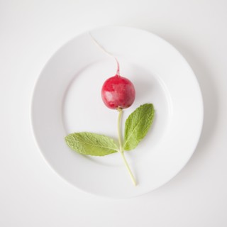 Flower on plate made out of food, studio shot. 
Photo: Jessica Peterson