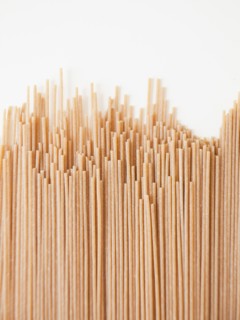 Spaghetti on white background, close-up. 
Photo : Jessica Peterson