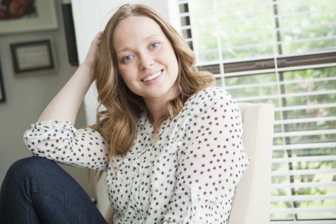 Portrait of happy young woman. 
Photo: Jessica Peterson