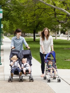 USA, Utah, Salt Lake City, Two young mothers walking with two baby boys (6-11 months) and toddler