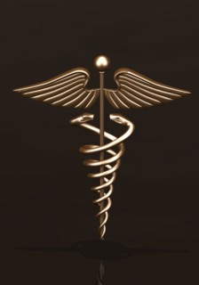 Brass caduceus on dark background. 
Photo : Calysta Images