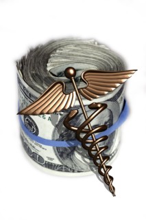Caduceus and wad of us dollar bills. 
Photo : Calysta Images
