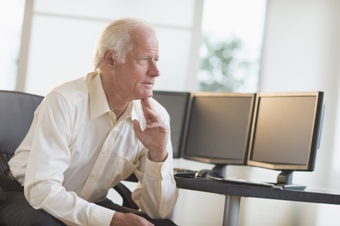 Senior professional in office.
