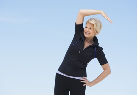 Mature woman exercising outdoors.
