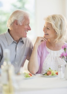 Couple enjoying healthy meal in restaurant.