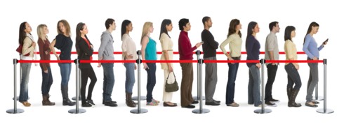 Studio shot of people waiting in line.